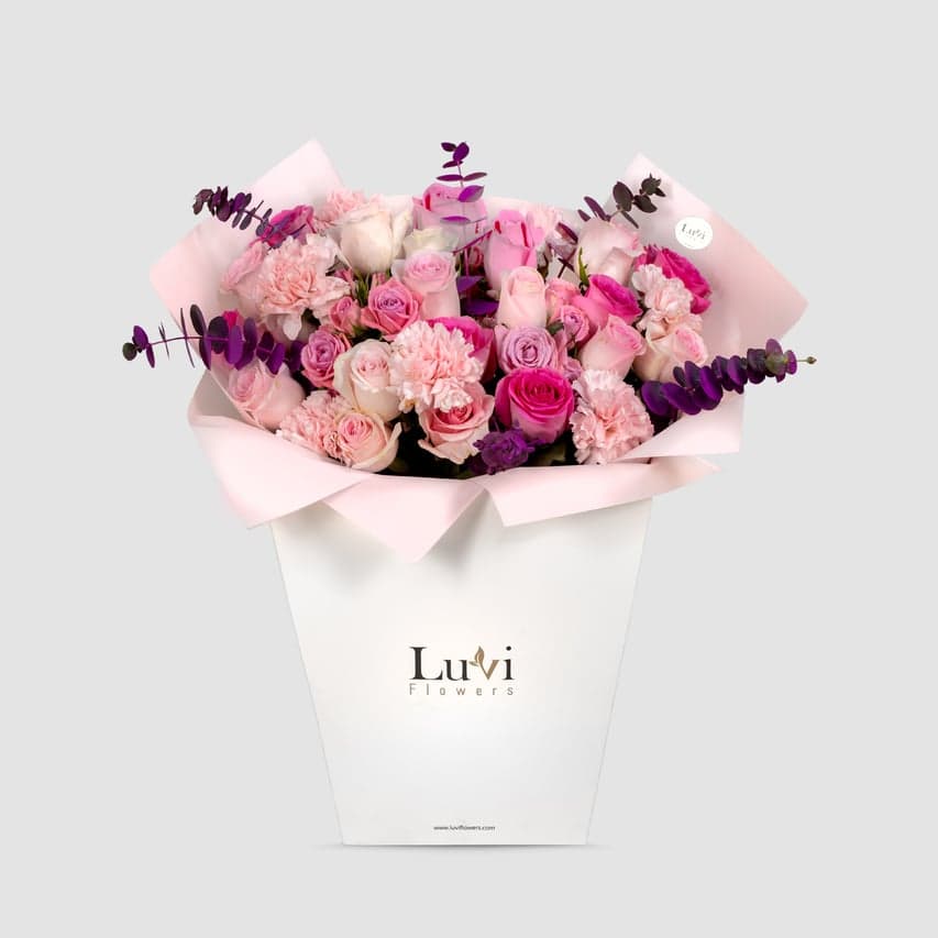 A Mother’s Touch – Soft pink roses and eucalyptus bouquet wrapped elegantly.