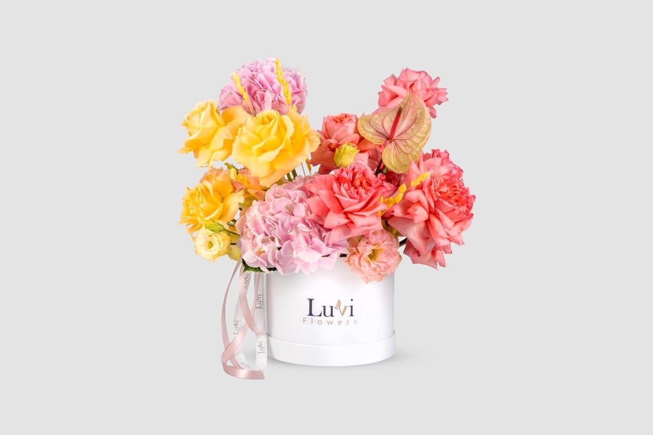 Medium Radiant Treasure arrangement with a mix of colorful flowers	
