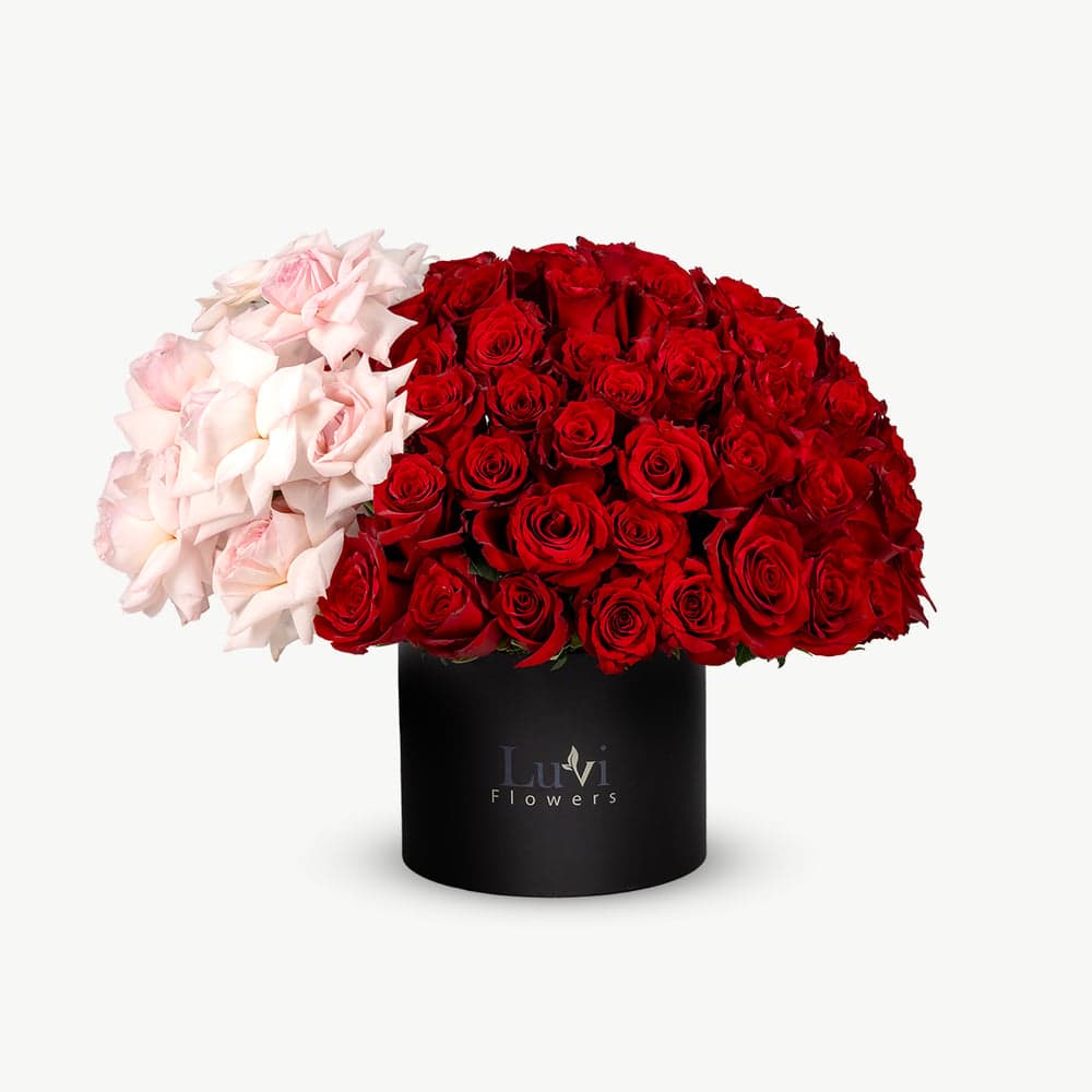 Large Pink Promises box arrangement with red and O'Hara pink roses.