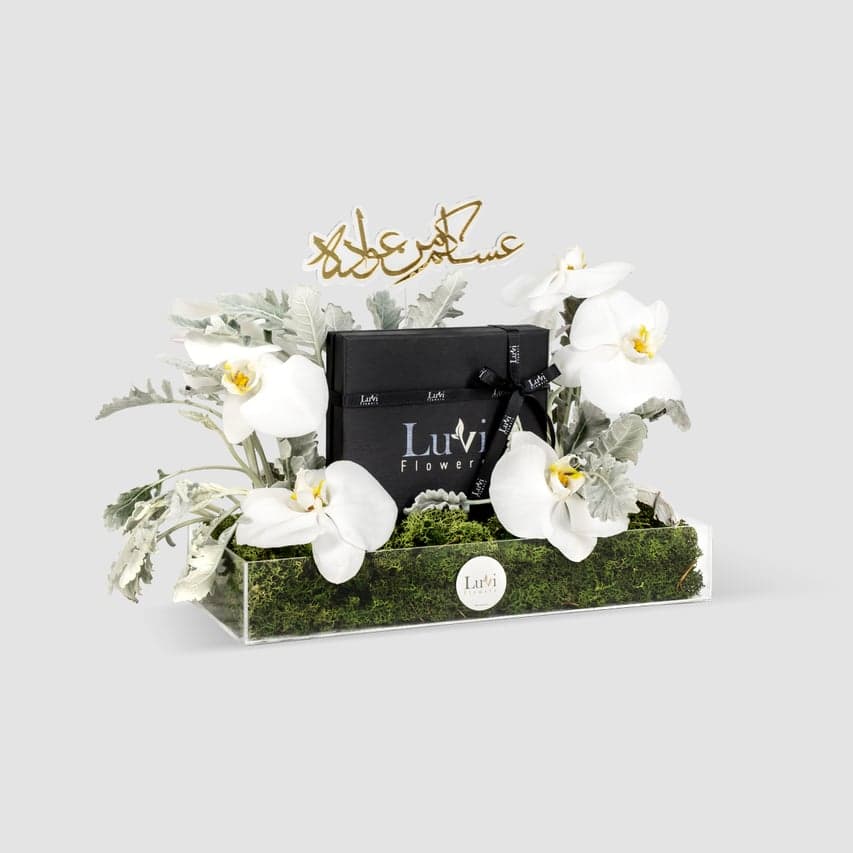Mubarak Bliss – Orchid floral arrangement in an acrylic box with chocolates.