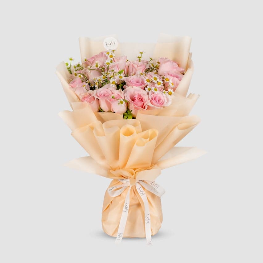 Feminine Charm bouquet with roses and chamomile.