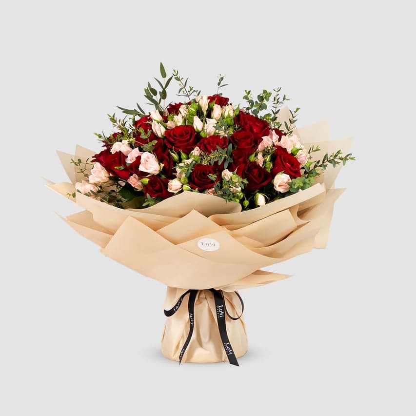 Large Valentina bouquet with pink spray roses, red roses, and eucalyptus. 