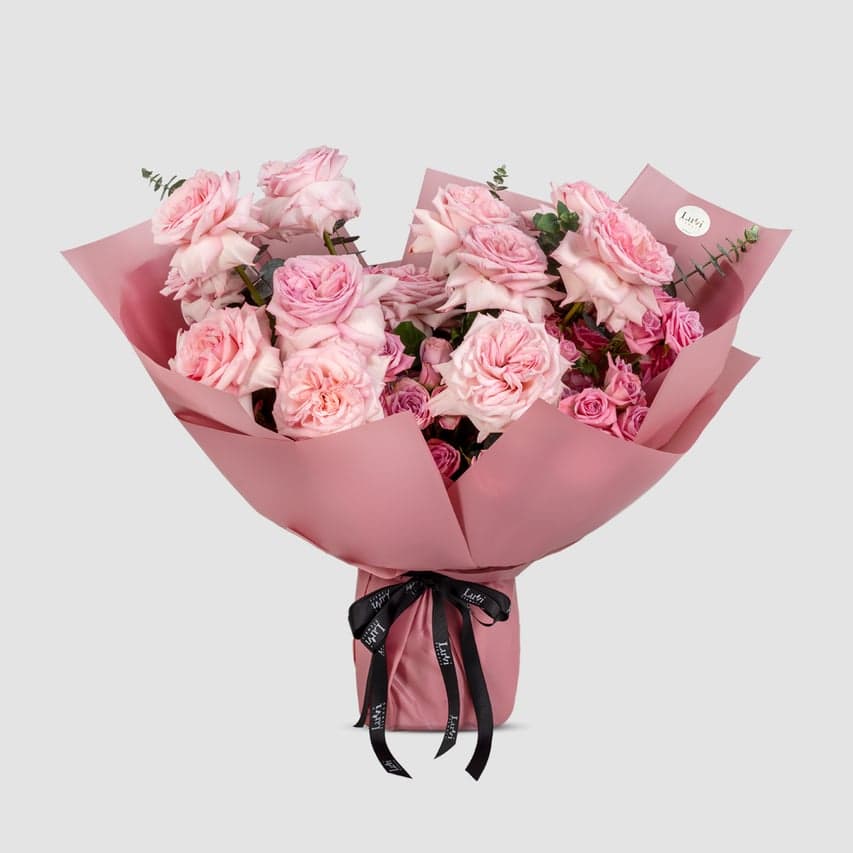  Loving Petals – Dark revival roses, pink carnations, and eucalyptus bouquet.