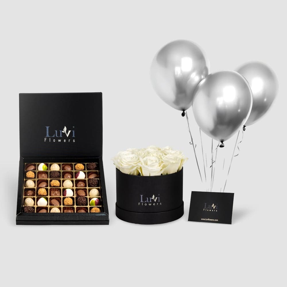باقة الورود الرومانسية والشوكولاتة مع ورود بيضاء وشوكولاتة شوكولالا كبيرة.
