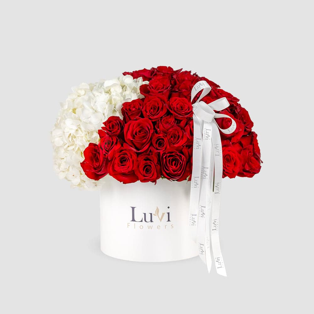 Large Valentine Bliss box arrangement with white hydrangeas and red roses. 