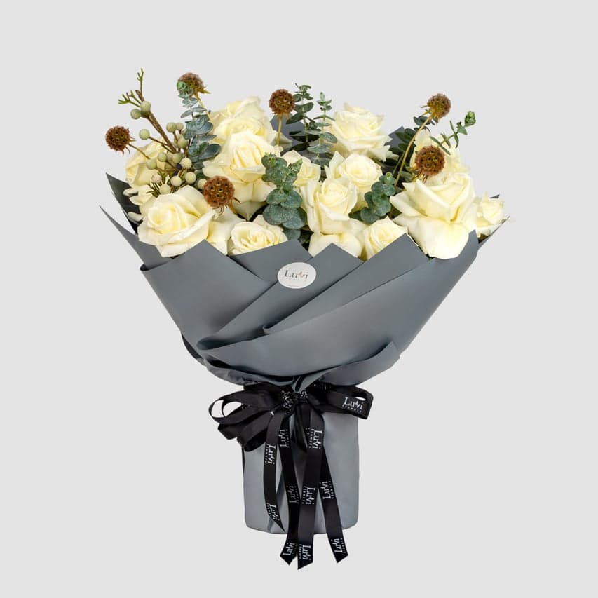 Pure Love – White roses, scabiosa, and eucalyptus bouquet.