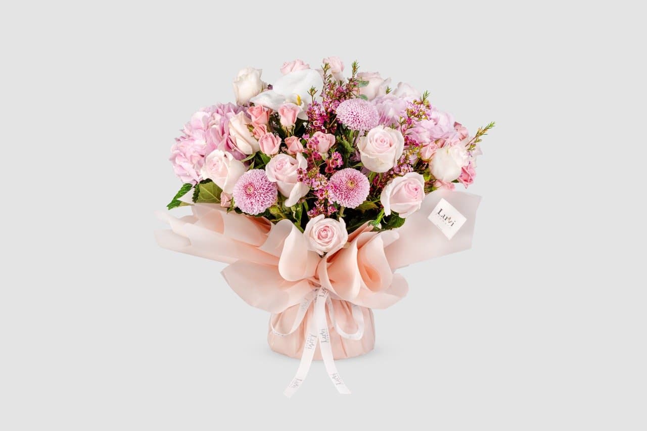 Medium Mystic Bloom bouquet with a mix of purple, pink, and white flowers	