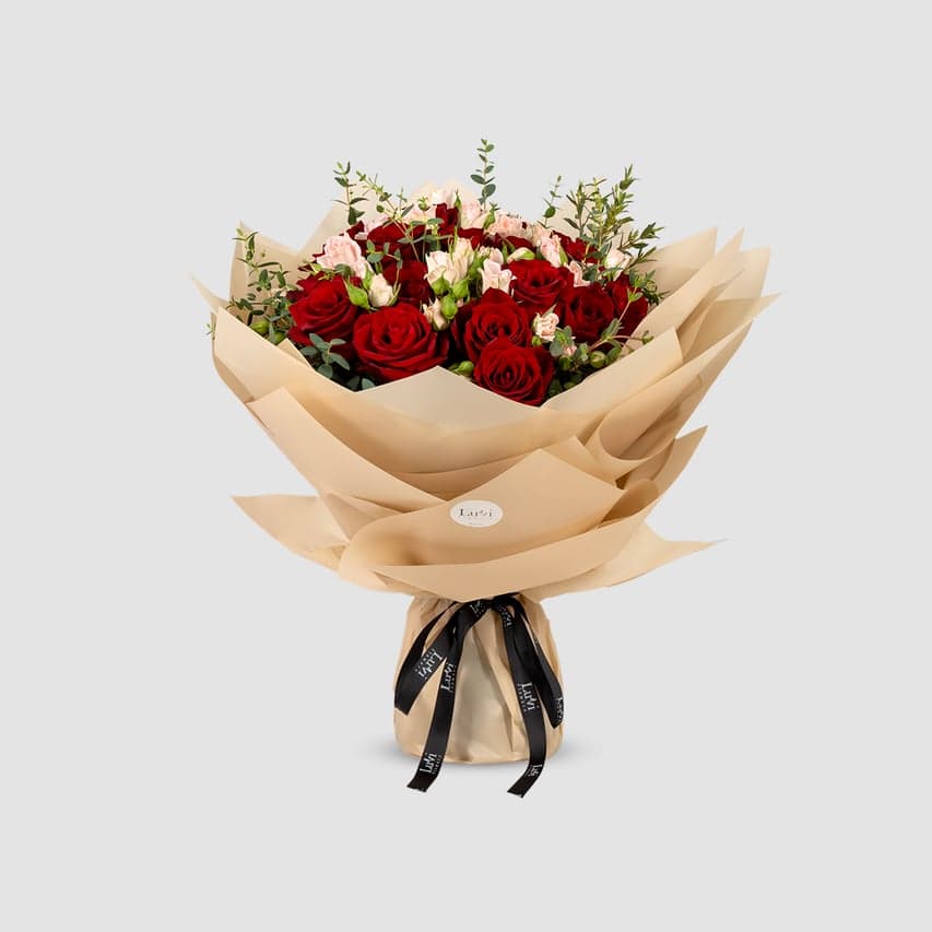 Medium Valentina bouquet with pink spray roses, red roses, and eucalyptus.