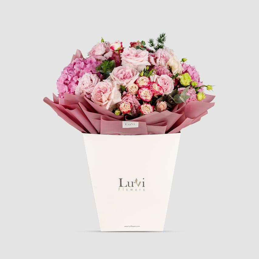 Sweet Arrival bouquet lovingly presented in a Luviflowers welcoming gift bag	