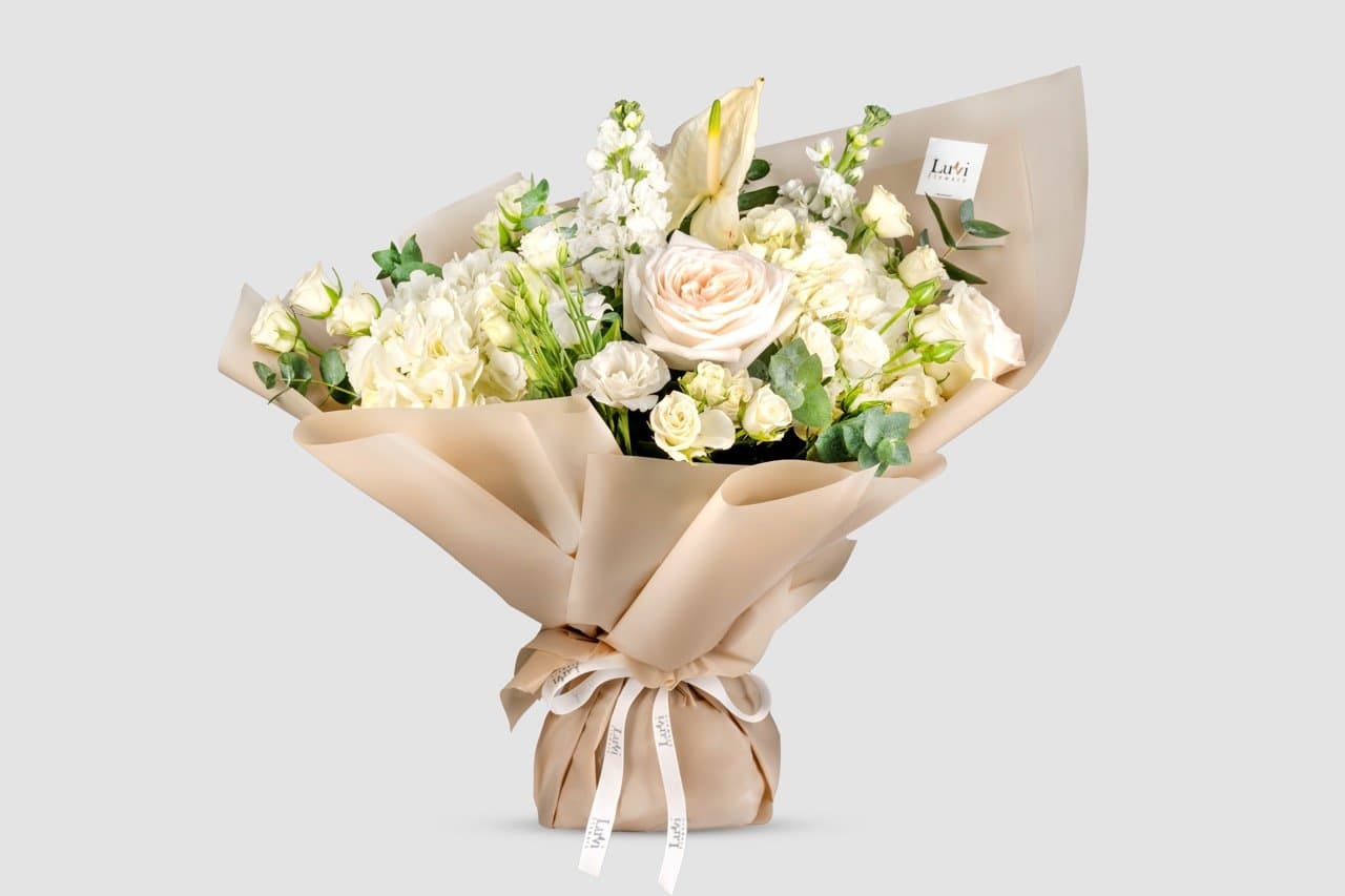Medium White Bliss bouquet with a blend of white flowers	