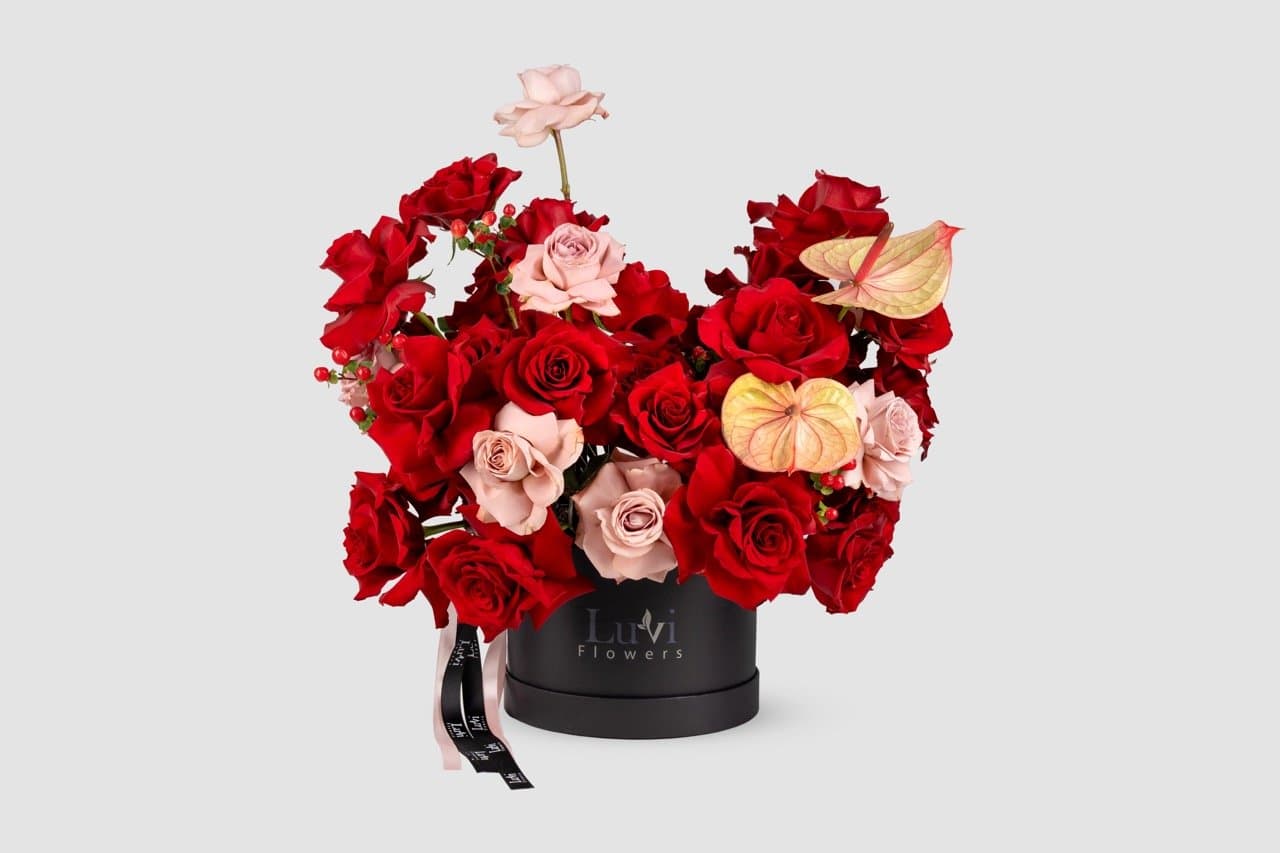 Medium Elegance in a Box arrangement with red and cappuccino roses	