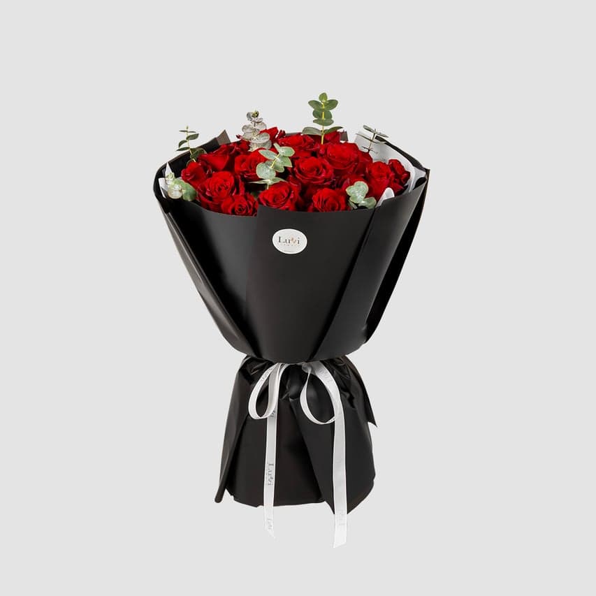 Small Forever Yours bouquet with a sleek black wrap.